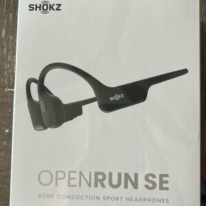 New opened box Shokz OpenRun SE headphones. Born construction sport headphones.